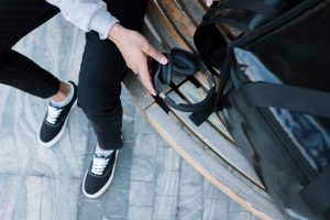 person in black pants and white socks